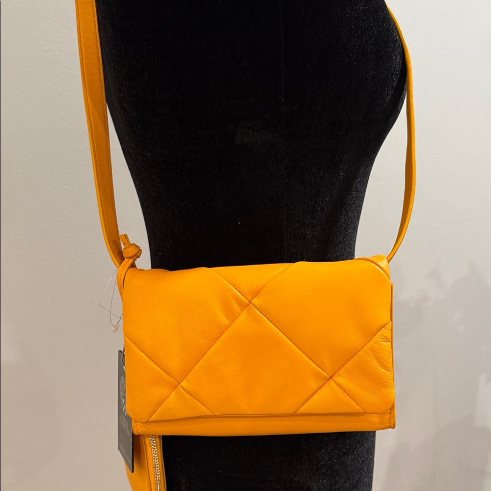 On sale!! 
Vince Camuto Vibrant Orange Quilted Crossbody Bag